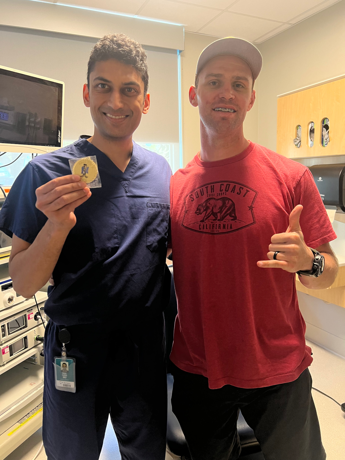 Dr. Garg receiving challenge coin from veteran patient